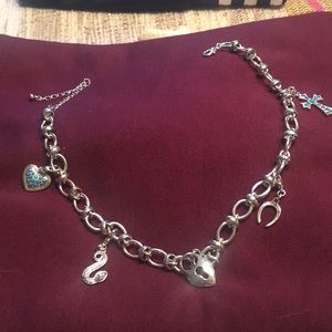 Silver tone charm necklace